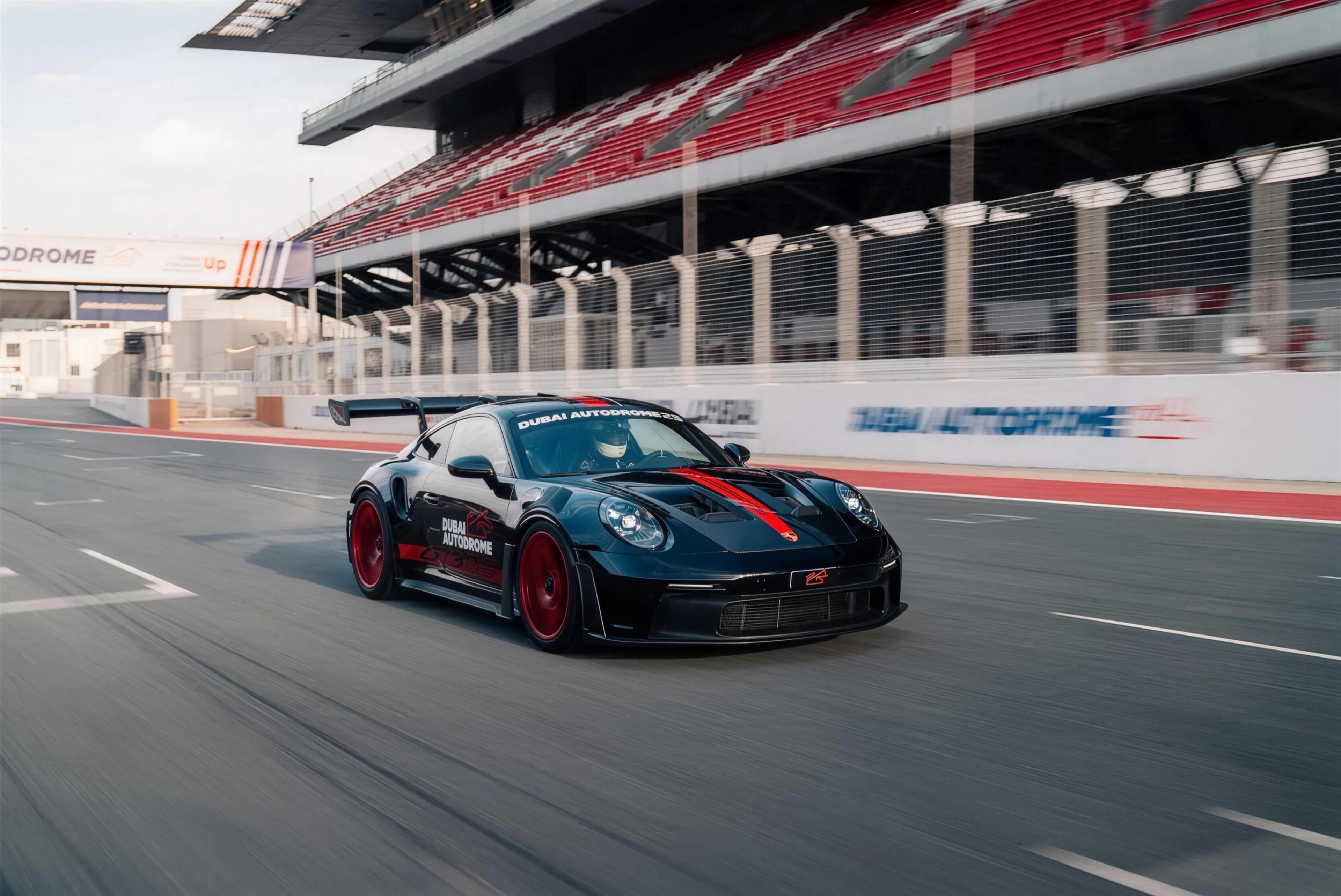 A Dubai Autodrome Porsche 911 GT3 RS on the main straight